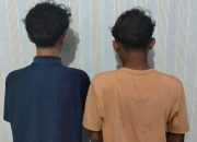 Dua remaja berinisial AA dan RK yang diduga hendak melakukan tawuran saat diamankan di Mapolresta Kendari